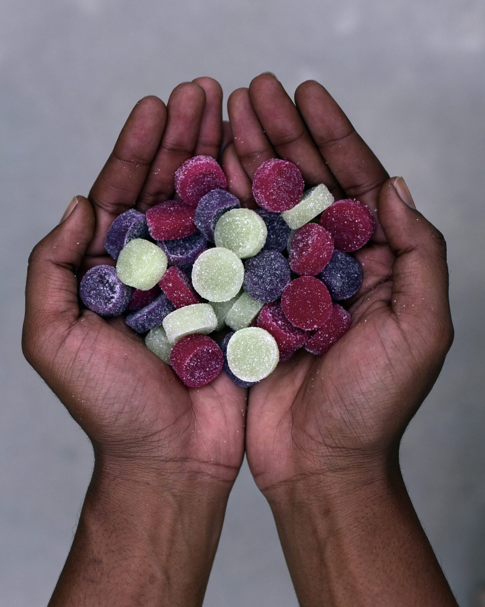 THC gummies in hands